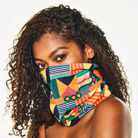 Woman with long, curly hair wearing the Multi-Use Beauty Band pulled up over her nose and mouth
