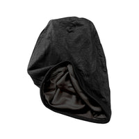 Black jersey beanie turned partly inside out to show its satin lining