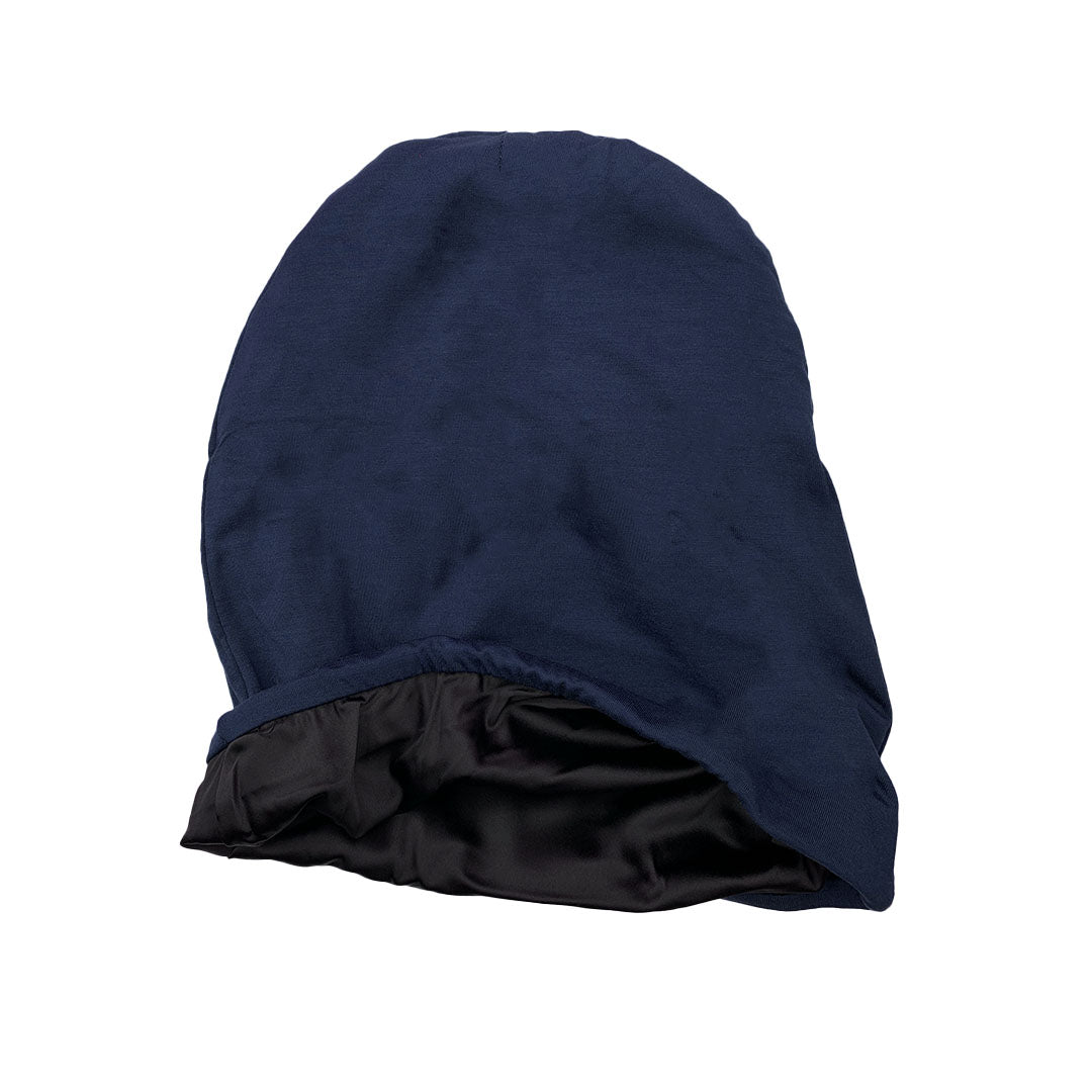 Navy jersey beanie turned partly inside out to show its black satin lining