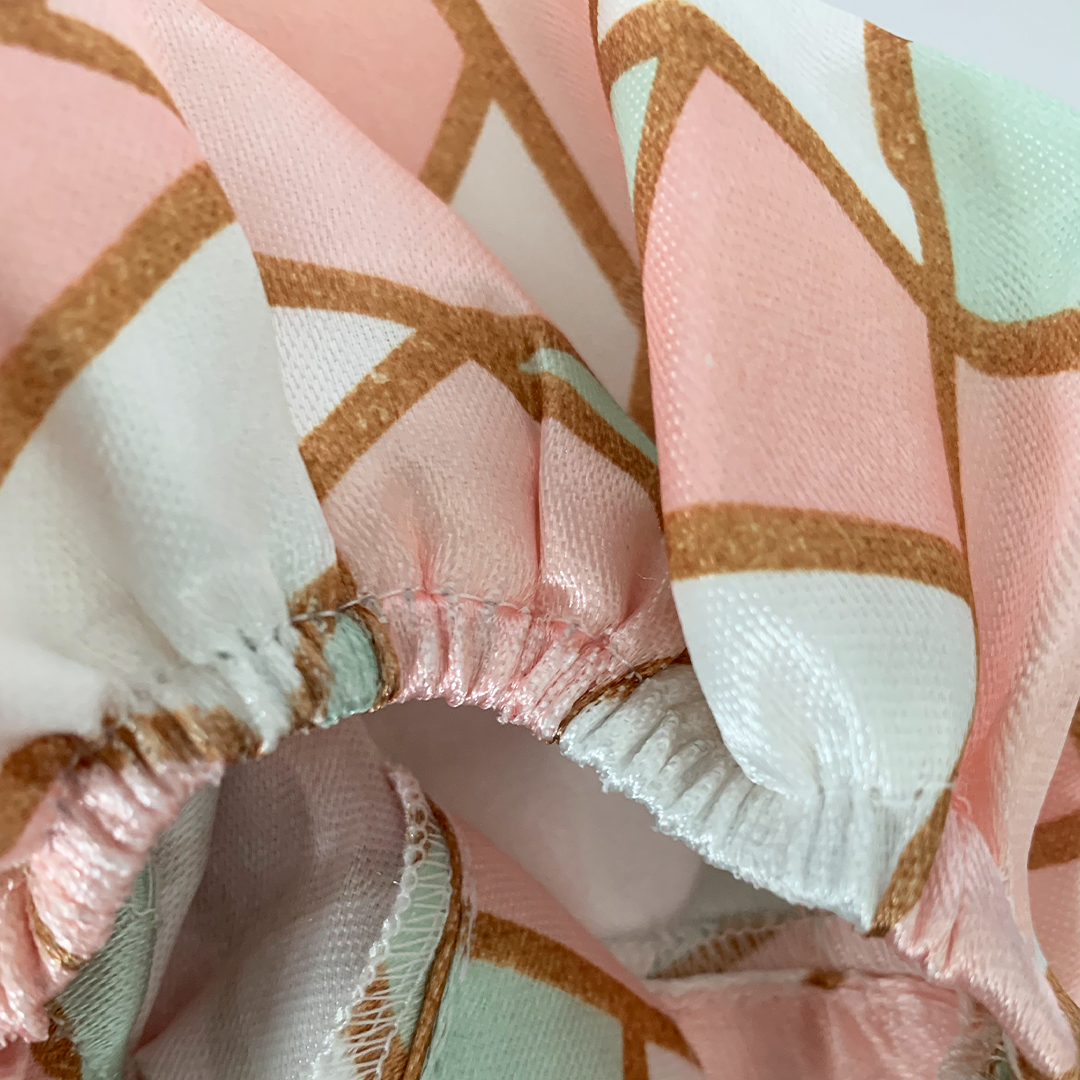 Close-up of the bonnet’s elastic edge and satin interior