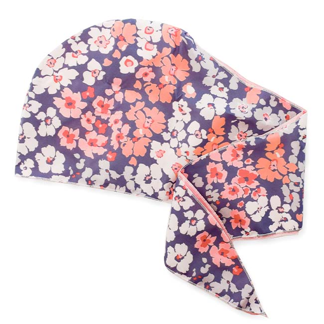 Floral Satin-Lined Wrap Cap in a navy print with pink, peach, and cream flowers, with long tie ends