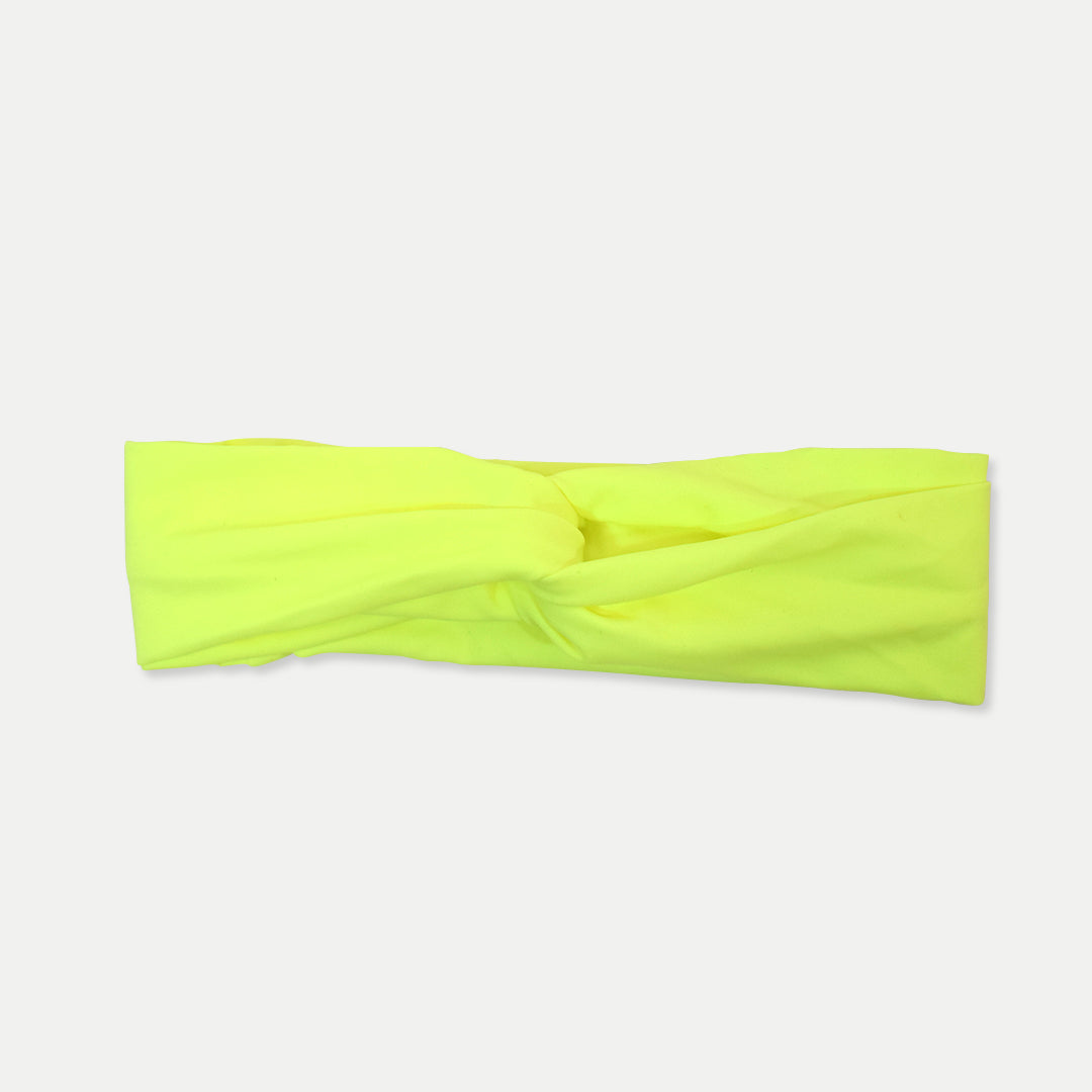 Neon yellow Fitband headband laid flat, showing its twist-front design